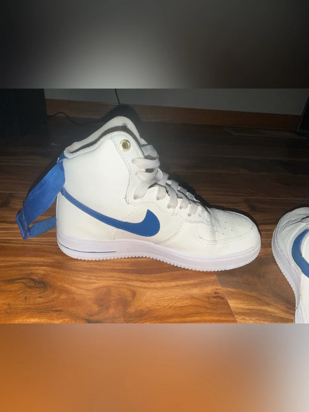 Nike White High-Top Sneakers with Blue Swoosh and Strap
